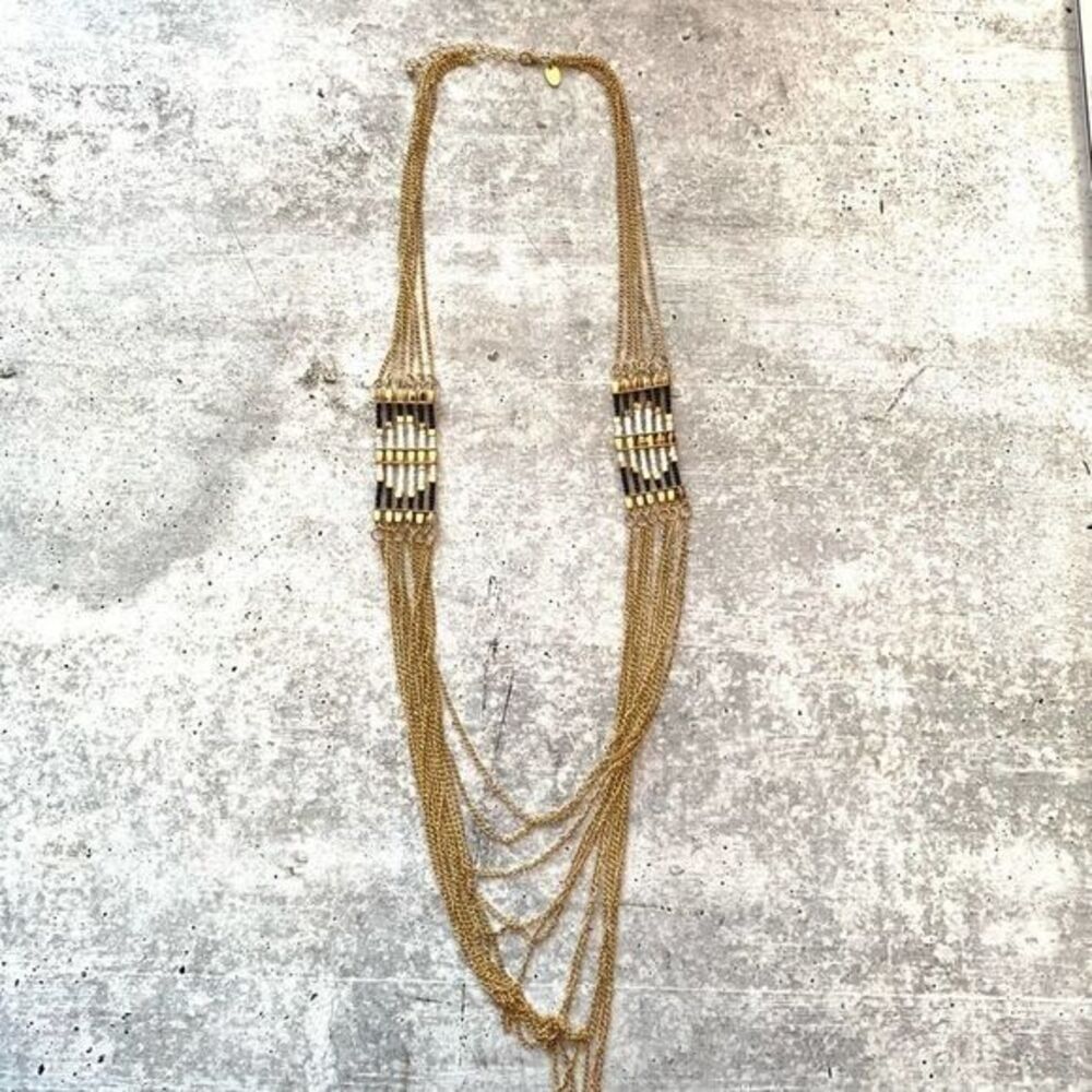 Long multi chain gold necklace with side beads